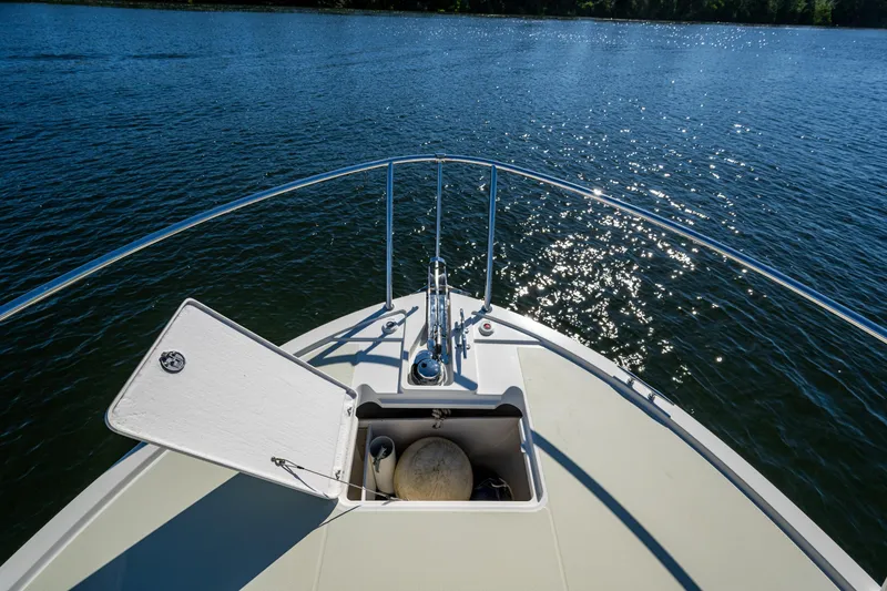 Slide: The Image of Bow view of 2020 Back Cove 340 boat on sparkling water. - 3
