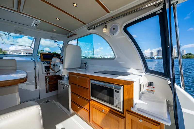 Slide: The Image of Interior of 2020 Back Cove 340 boat with modern kitchen and scenic water view. - 30