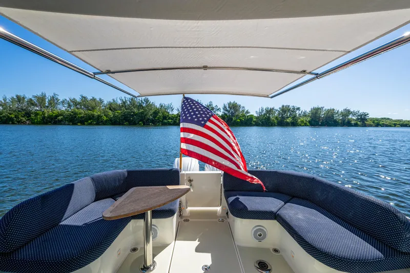 Slide: The Image of 2020 Back Cove 340 boat interior with American flag, scenic water view. - 32
