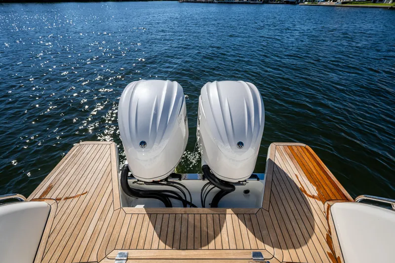 Slide: The Image of 2020 Back Cove 340 boat with dual outboard engines on a sunny day. - 35