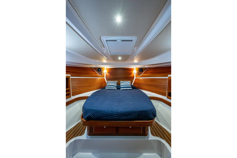 Slide: The Image of Luxurious cabin interior of 2020 Back Cove 340 yacht with elegant wood paneling. - 7