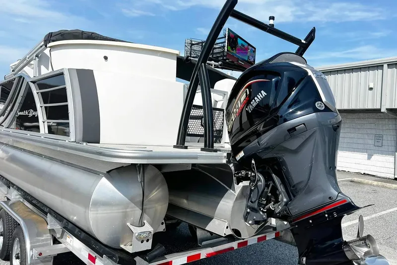 Slide: The Image of 2023 South Bay 523 R pontoon boat with Yamaha outboard motor on a trailer. - 10