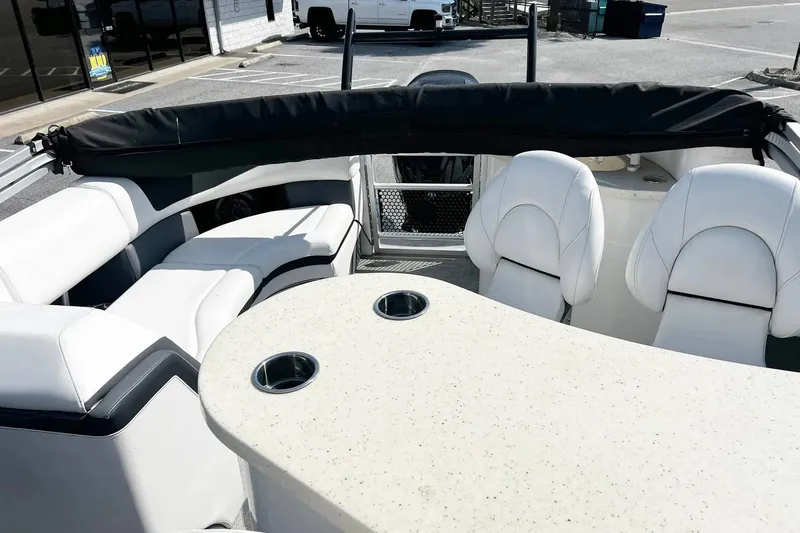 Slide: The Image of Interior of 2023 South Bay 523 R boat with white seating and table. - 6