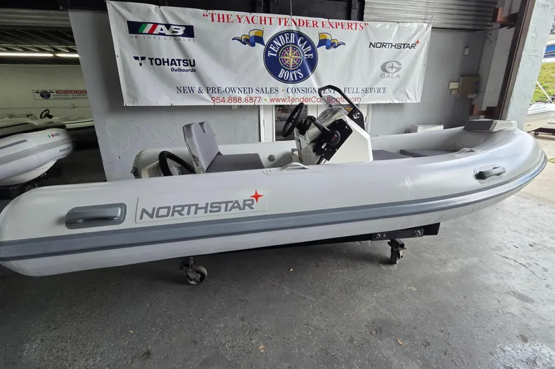 The Image of 2026 Northstar Vega 3.8 inflatable boat with Yamaha 30HP engine in showroom. - 0