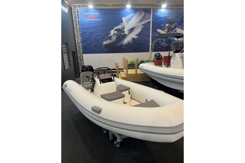 Slide: The Image of 2026 Northstar Vega 3.8 boat with Yamaha 30HP engine in showroom. - 5
