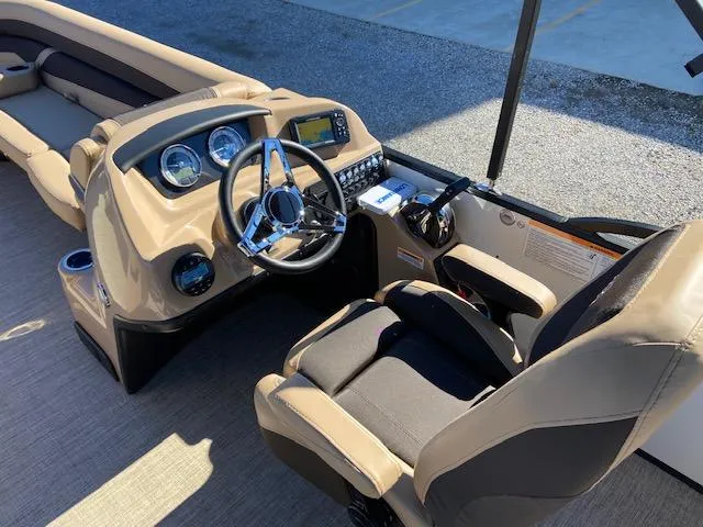 Slide: The Image of 2022 Barletta Cabrio C24UC boat interior with steering wheel and dashboard. - 11