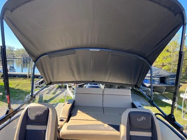 Slide: The Image of 2022 Barletta Cabrio C24UC pontoon boat with canopy and seating. - 13