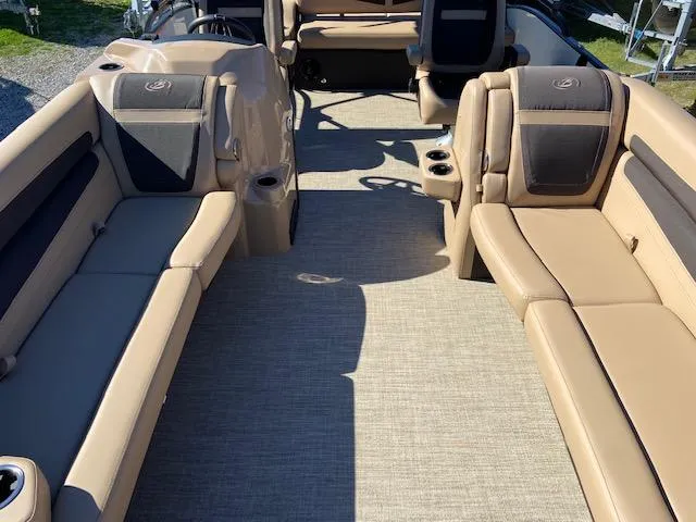 Slide: The Image of 2022 Barletta Cabrio C24UC boat interior with tan and gray seating. - 17