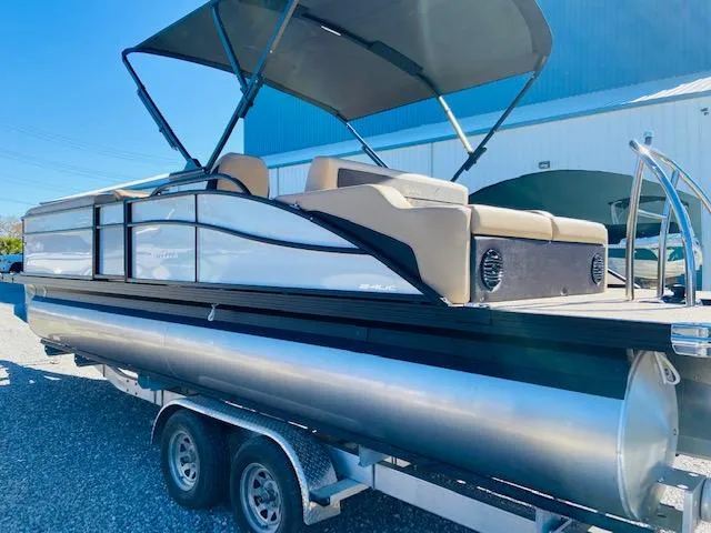 Slide: The Image of 2022 Barletta Cabrio C24UC pontoon boat on a trailer with canopy. - 4