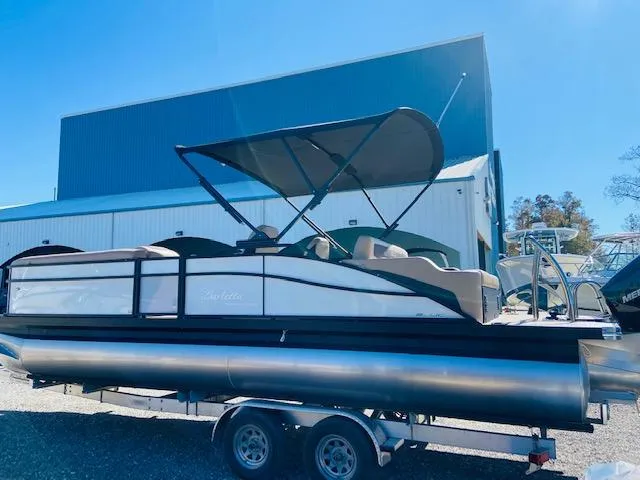 Slide: The Image of 2022 Barletta Cabrio C24UC pontoon boat with canopy on trailer. - 5