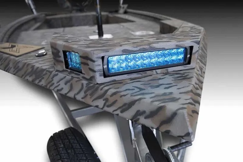 Slide: The Image of 2026 Xpress X18DB boat with camo design and blue LED lights. - 10