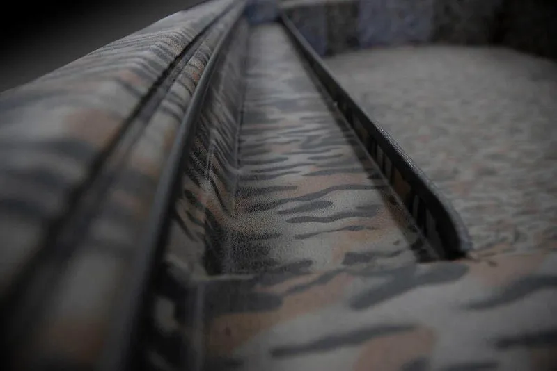 Slide: The Image of Close-up of 2026 Xpress X18DB boat with camouflage pattern detailing. - 11