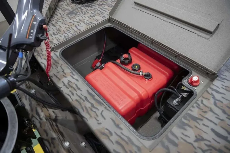 Slide: The Image of 2026 Xpress X18DB boat compartment with red fuel tank and battery. - 14