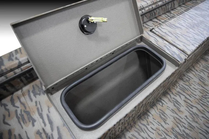 Slide: The Image of Open storage compartment in 2026 Xpress X18DB boat with camo pattern interior. - 15