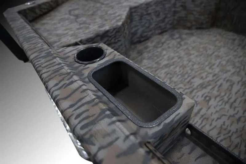 Slide: The Image of 2026 Xpress X18DB boat interior with camouflage design and cup holder. - 16