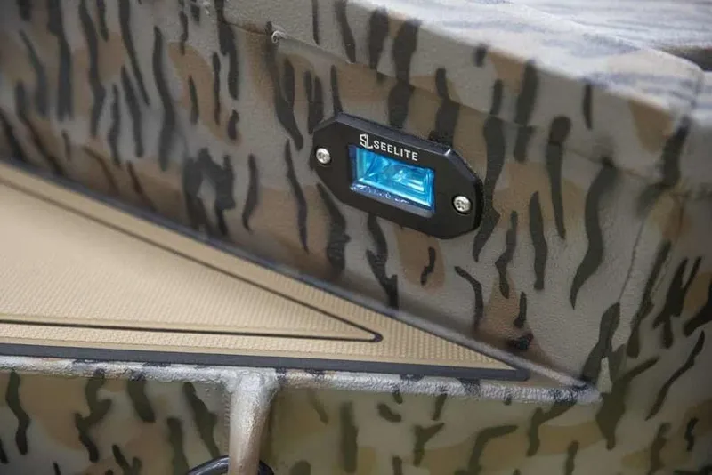 Slide: The Image of Camouflage-patterned Xpress X18DB boat with Seelite blue light, 2026 model. - 19