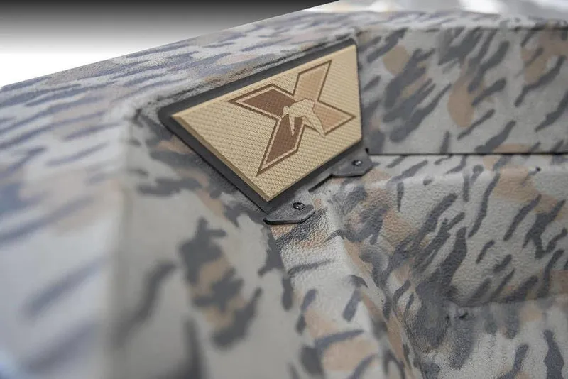 Slide: The Image of Camouflage-patterned Xpress X18DB boat detail with logo, 2026 model. - 9