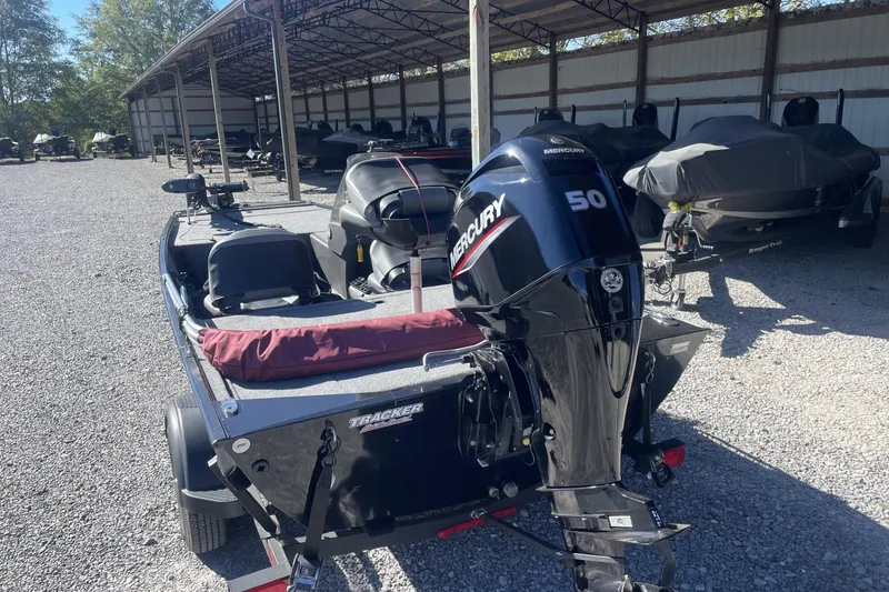 Slide: The Image of 2024 Bass Tracker Classic XL boat with Mercury 50 engine in storage facility. - 4