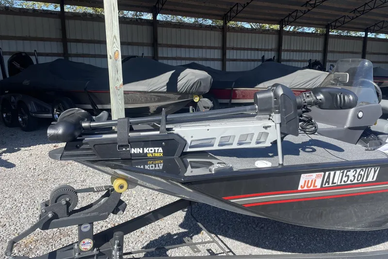 Slide: The Image of 2024 Bass Tracker Classic XL boat with Minn Kota Ultrex motor in storage. - 7