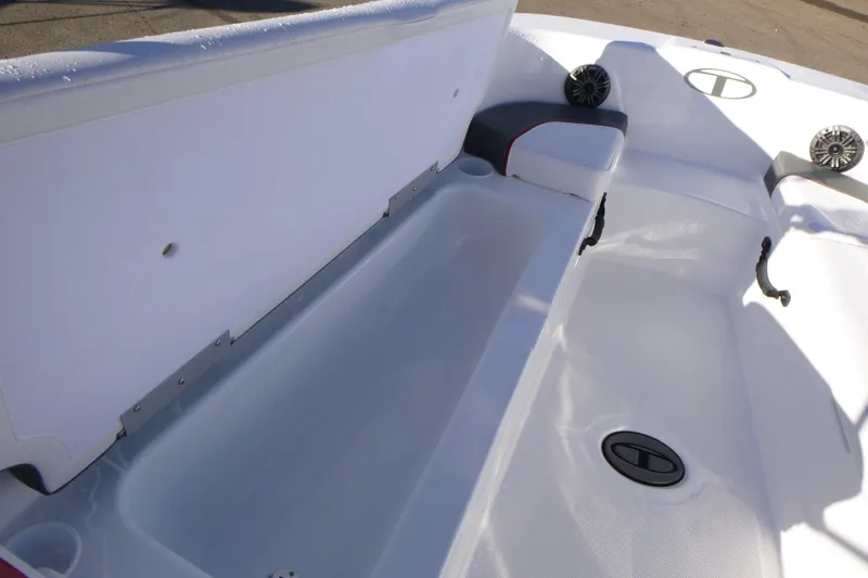 Slide: The Image of 2024 Tahoe T18 boat interior with open storage compartment and seating area. - 19