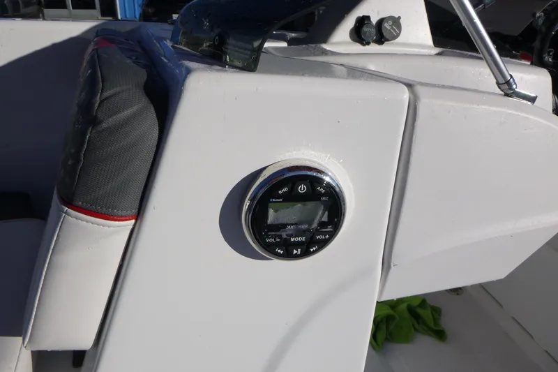 Slide: The Image of 2024 Tahoe T18 boat dashboard with audio control panel. - 21