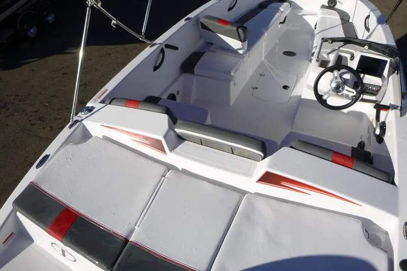 Slide: The Image of 2024 Tahoe T18 boat interior with modern seating and steering wheel. - 7