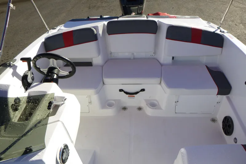 Slide: The Image of 2024 Tahoe T18 boat interior with seating and steering wheel. - 9