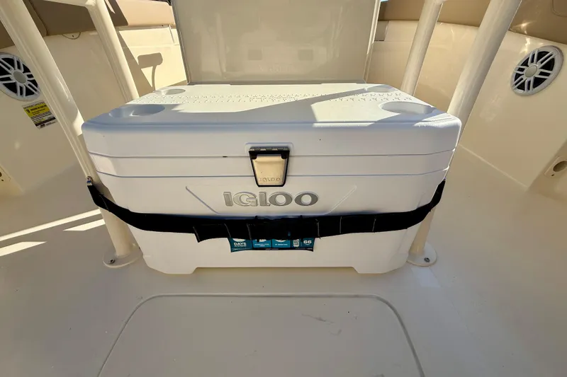 Slide: The Image of 2025 Scout 215 XSF boat interior with Igloo cooler secured on deck. - 10