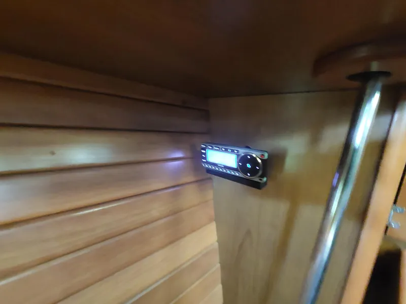 Slide: The Image of Boat interior with wooden paneling and a mounted stereo system, Hunter 49, 2009 model. - 11