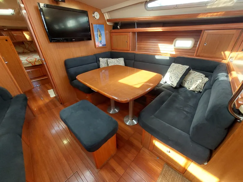 Slide: The Image of Luxurious 2009 Hunter 49 yacht interior with cozy seating and elegant wood finish. - 13