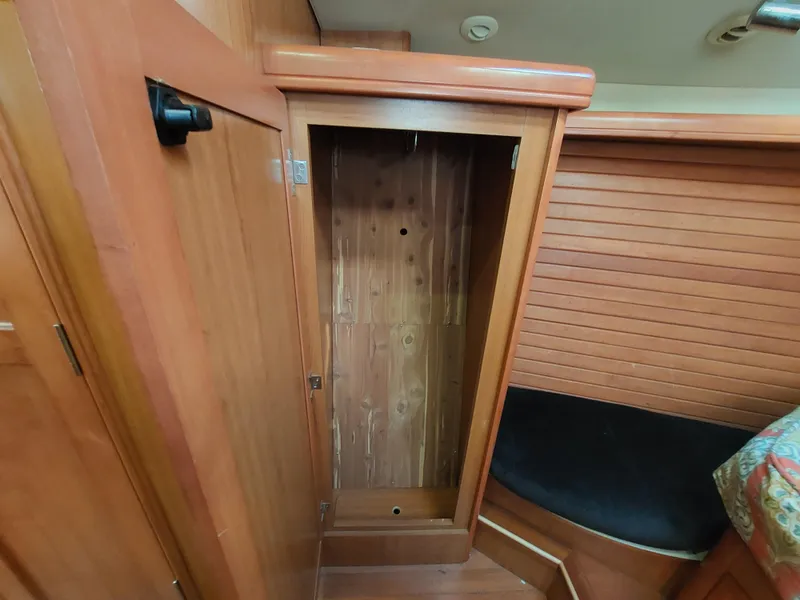 Slide: The Image of Empty wooden closet in 2009 Hunter 49 boat interior. - 35