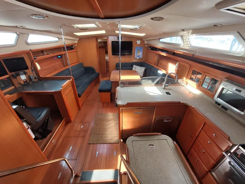 Slide: The Image of Spacious interior of 2009 Hunter 49 yacht with modern kitchen and seating area. - 4