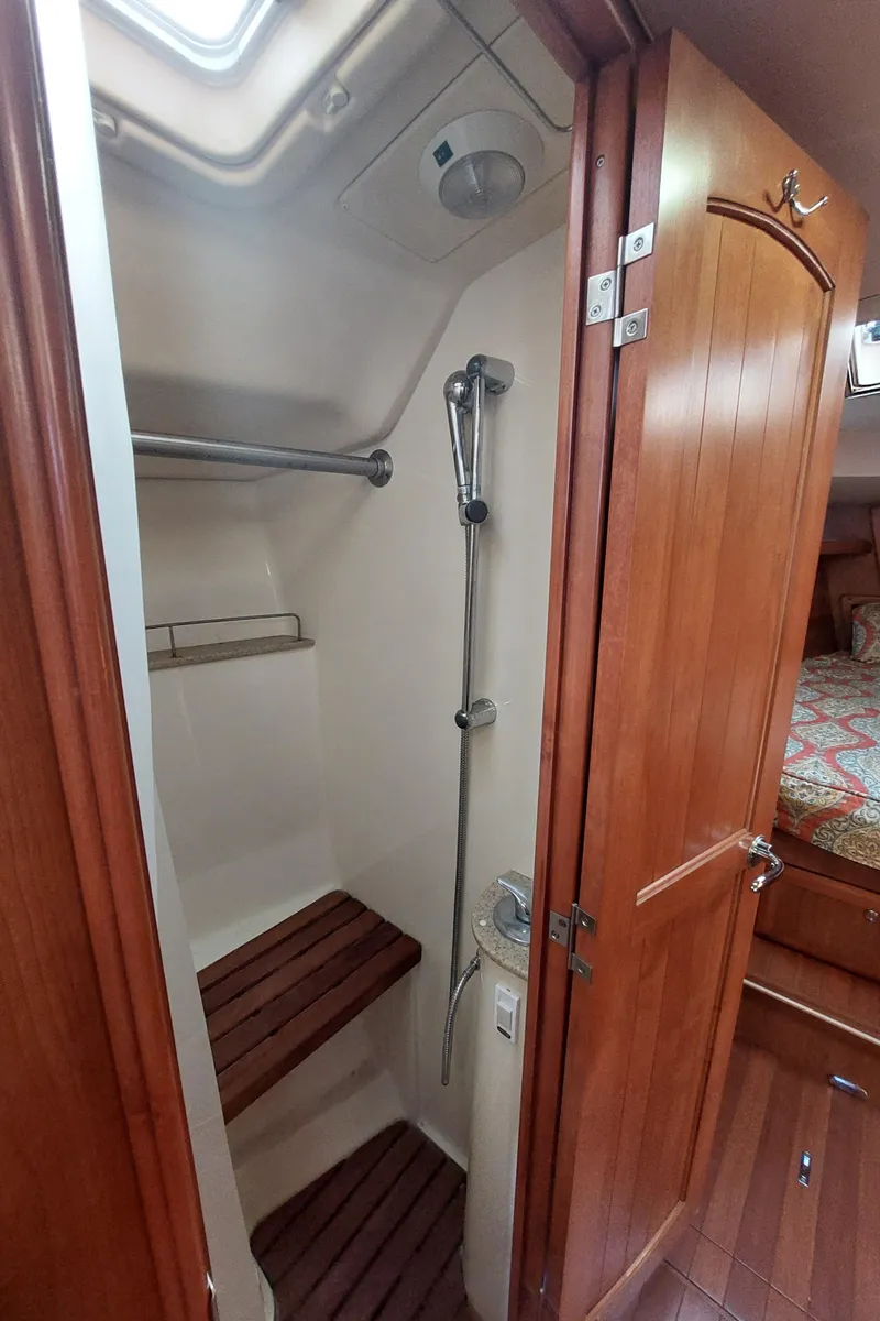 Slide: The Image of 2009 Hunter 49 yacht shower with wooden accents and modern fixtures. - 41