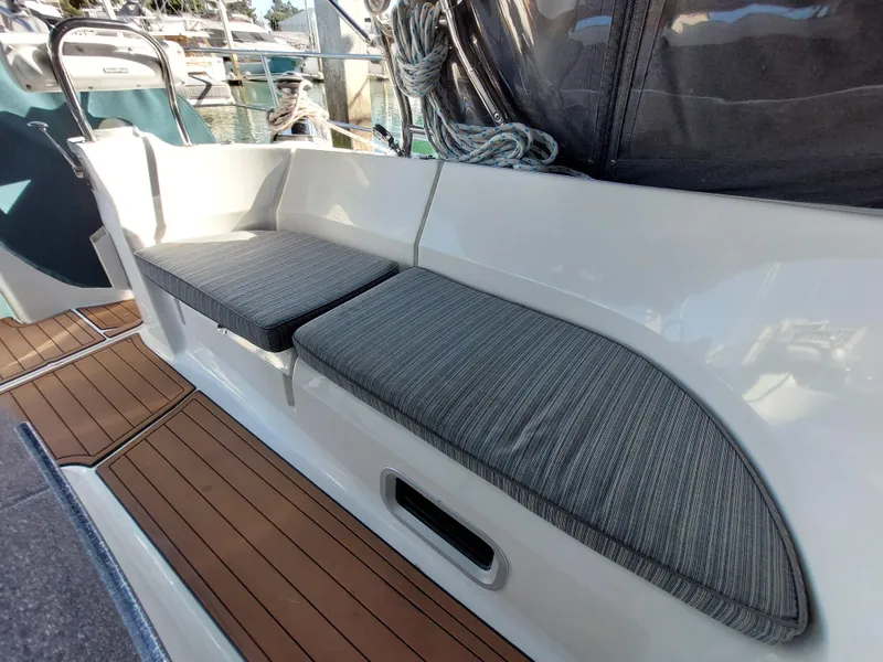 Slide: The Image of Hunter 49 sailboat cockpit seating with gray cushions, 2009 model. - 49