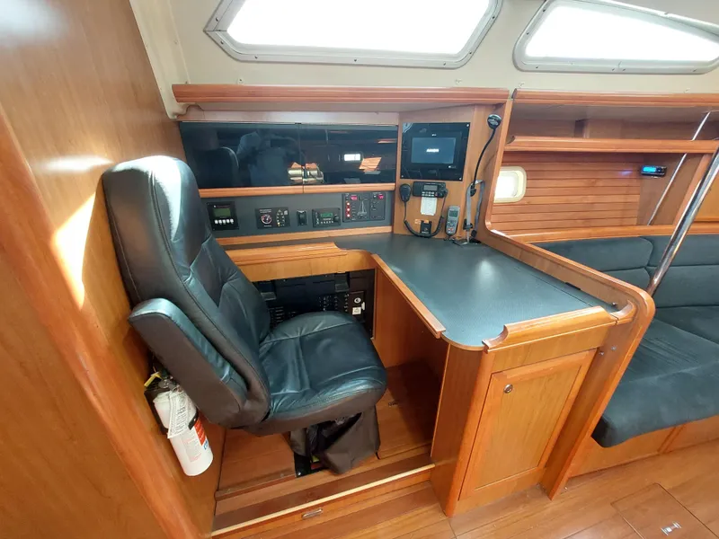 Slide: The Image of Interior of 2009 Hunter 49 yacht with navigation station and leather chair. - 5
