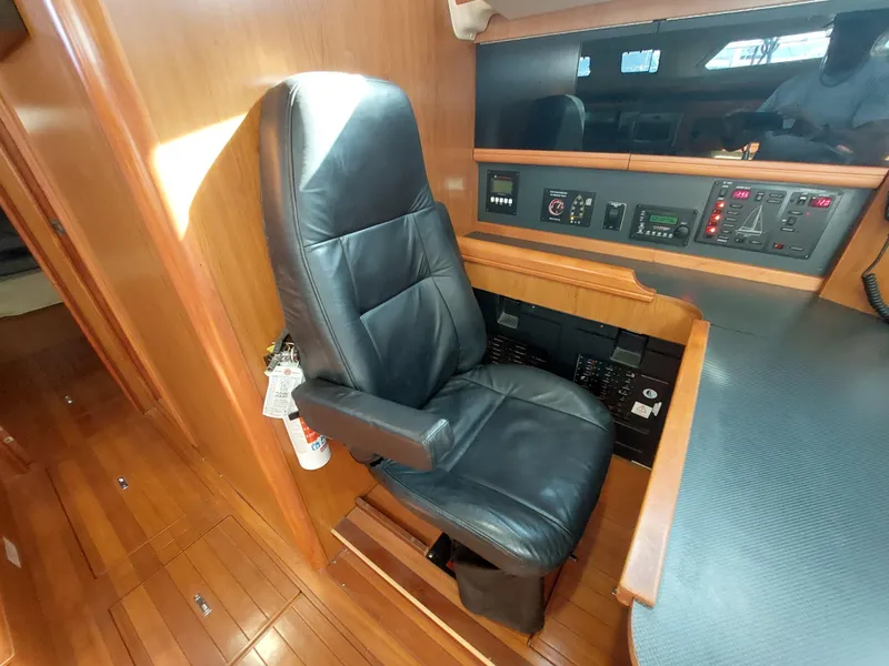 Slide: The Image of Luxurious leather chair in 2009 Hunter 49 yacht's navigation station. - 8