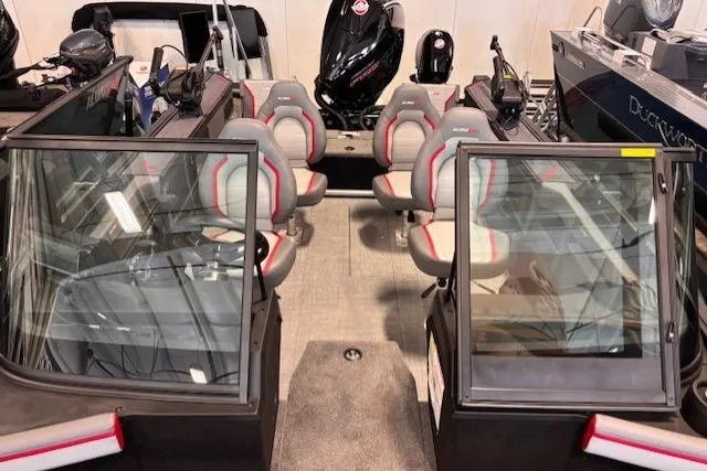 Slide: The Image of 2025 Alumacraft Trophy 185X Sport boat interior with seating and windshield. - 8