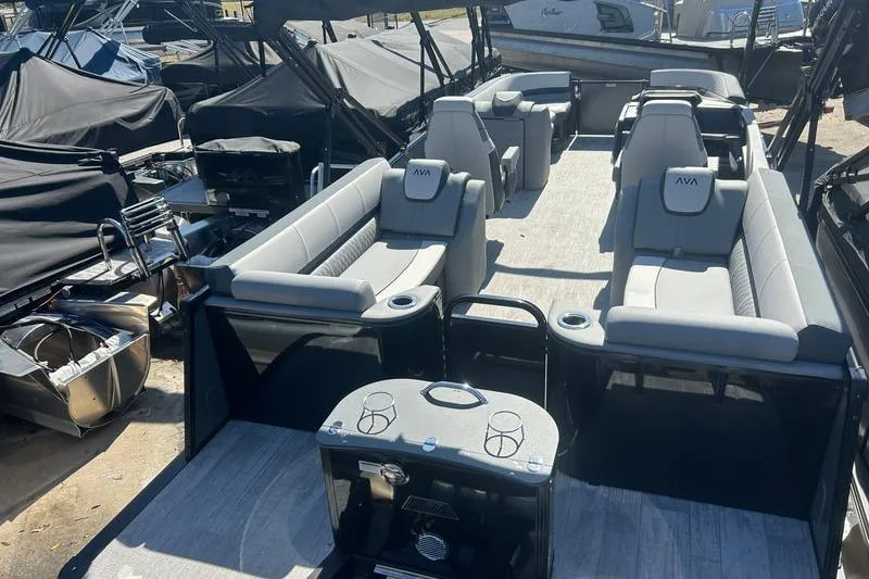 Slide: The Image of 2025 Avalon Catalina Quad Lounger pontoon boat with spacious seating and modern design. - 2