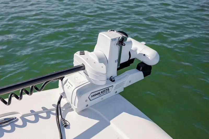 Slide: The Image of Minn Kota trolling motor on 2024 Tidewater 2300 Carolina Bay boat in water. - 17