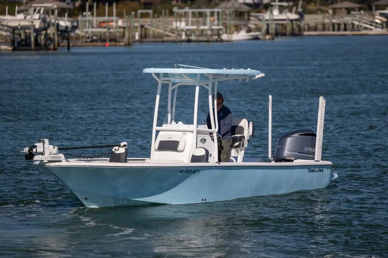 Slide: The Image of 2024 Tidewater 2300 Carolina Bay boat cruising on calm waters. - 3