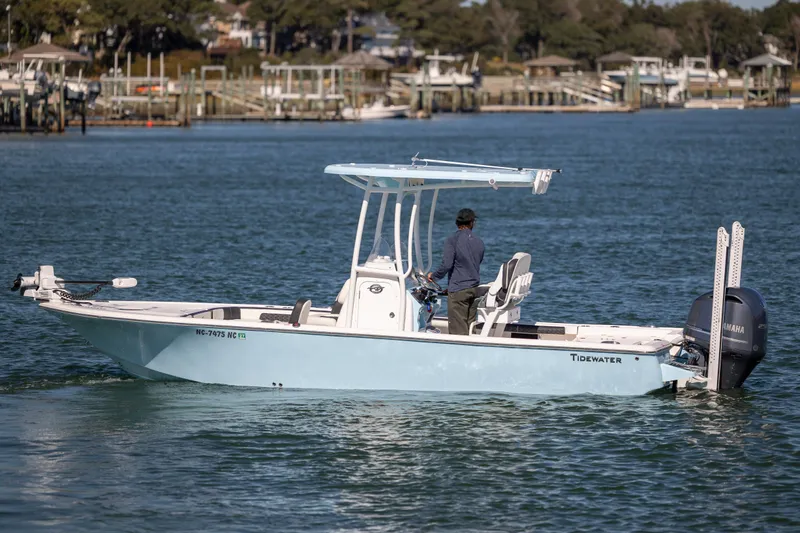 Slide: The Image of 2024 Tidewater 2300 Carolina Bay boat on water, featuring Yamaha engine. - 4