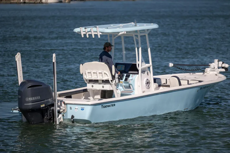 Slide: The Image of 2024 Tidewater 2300 Carolina Bay boat on water with Yamaha engine. - 6