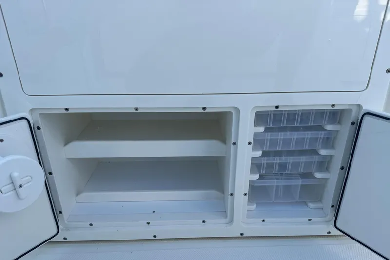 Slide: The Image of Storage compartments on a 2026 Cobia 285 Open Center Console boat. - 22