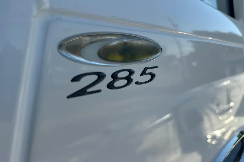 Slide: The Image of 2026 Cobia 285 Open Center Console boat emblem close-up. - 37