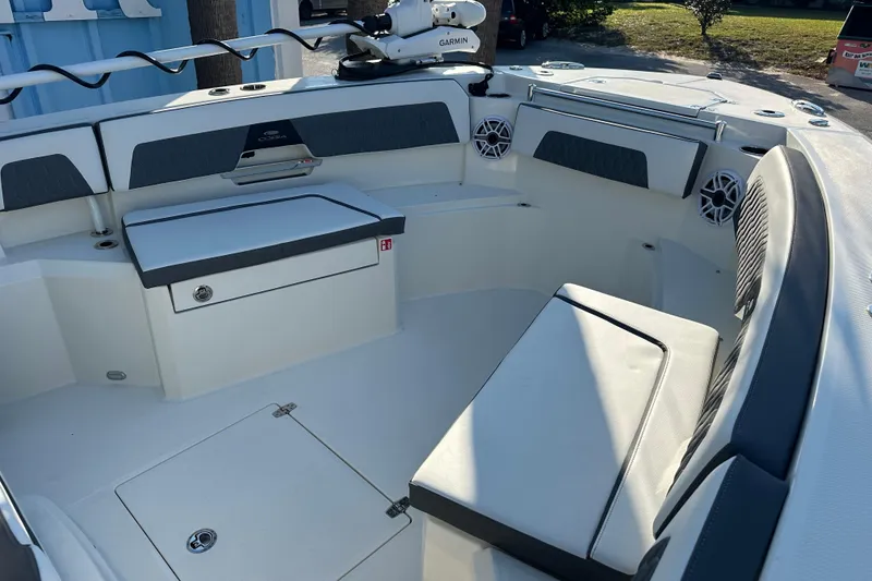 Slide: The Image of 2026 Cobia 285 Open Center Console boat interior with seating and storage. - 40