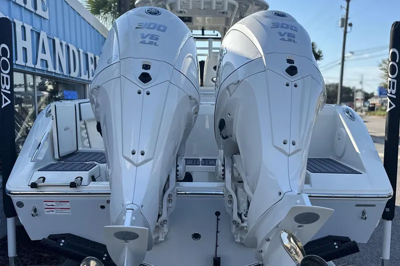 Slide: The Image of 2026 Cobia 285 Open Center Console with twin 300 V6 outboard engines. - 8