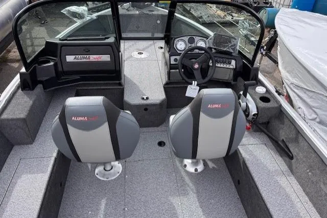 Slide: The Image of 2024 Alumacraft Voyageur 175 Sport boat interior with dual seats and modern dashboard. - 5