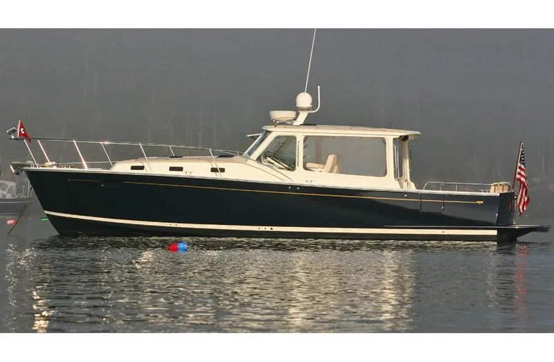 Slide: The Image of Interior view from 2017 MJM 40z Downeast boat, overlooking marina with docked boats. - 20