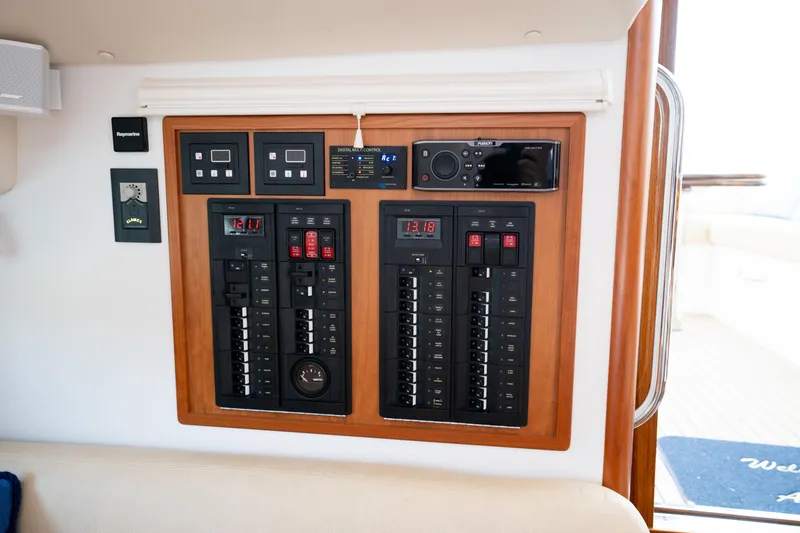 Slide: The Image of Control panel of 2017 MJM 40z Downeast boat, featuring digital displays and switches. - 37