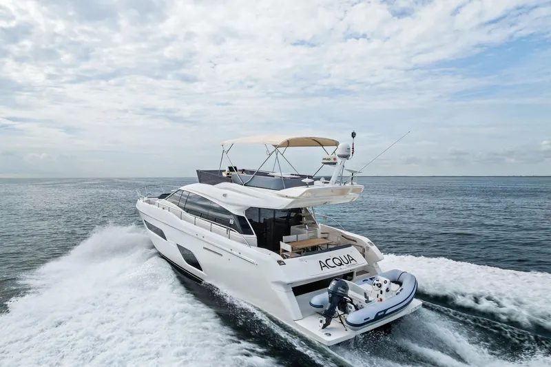 Slide: The Image of Luxurious 2018 Ferretti Yachts 550 deck with sleek seating and ocean view. - 24